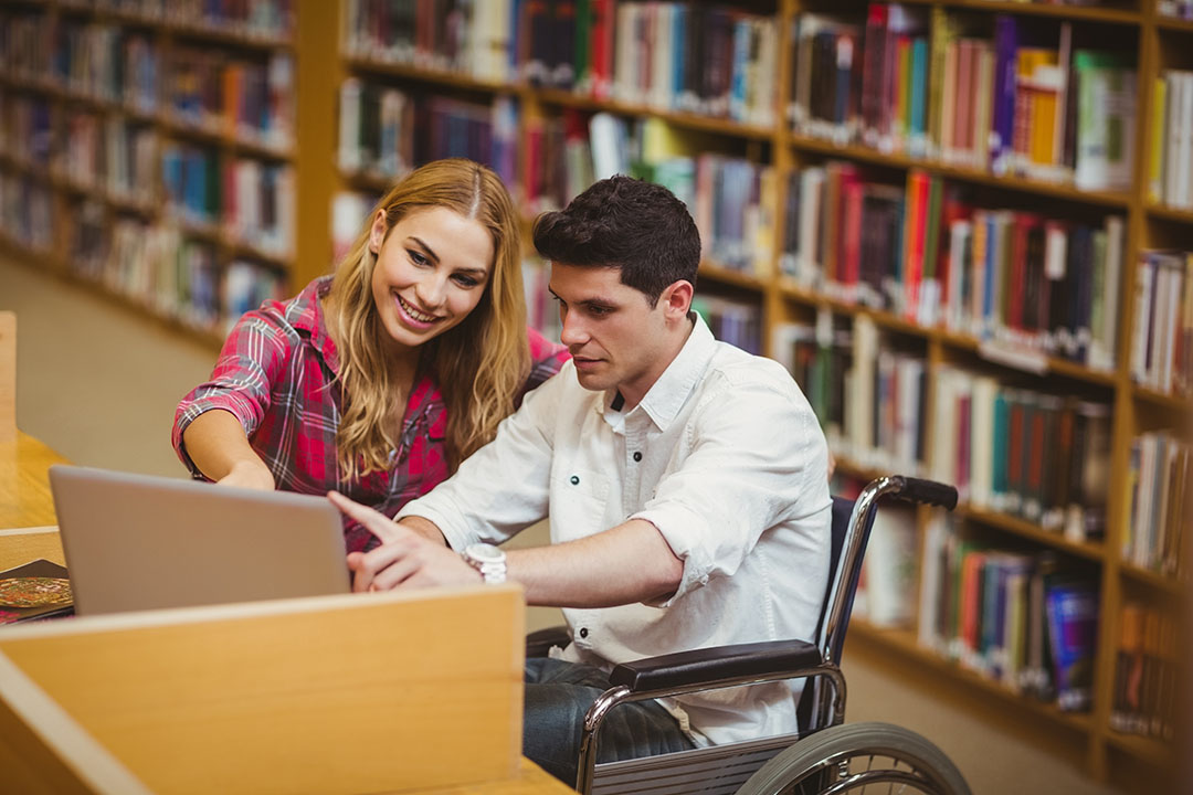 Student in wheelchair studying