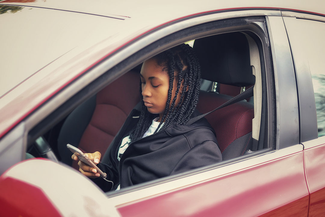 Female texting while driving