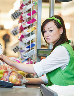 Grocery cashier at her register