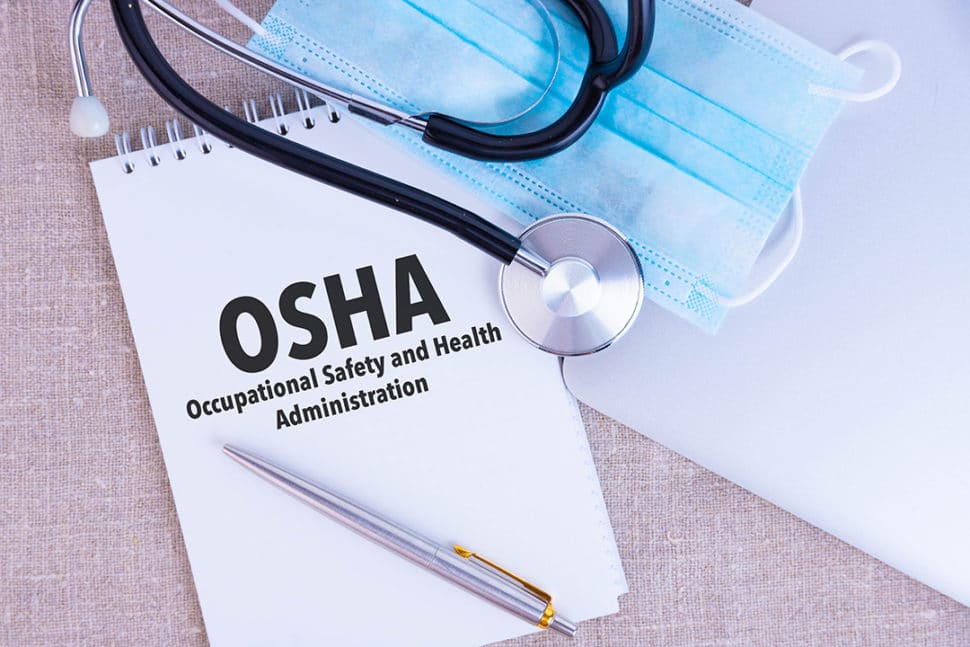 OSHA notebook with PPE