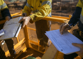 construction workers recording risks