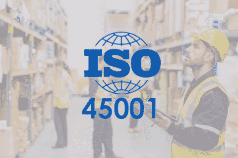 man in warehouse on ipad ISO 45001