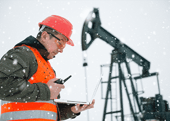 oil and gas employee using online safety training on tablet
